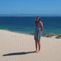 Sarah in the dunes with Africa in the back